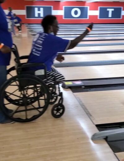 Amputee in wheelchair bowling