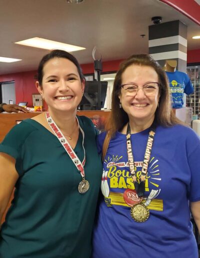 Smiling people wearing medals