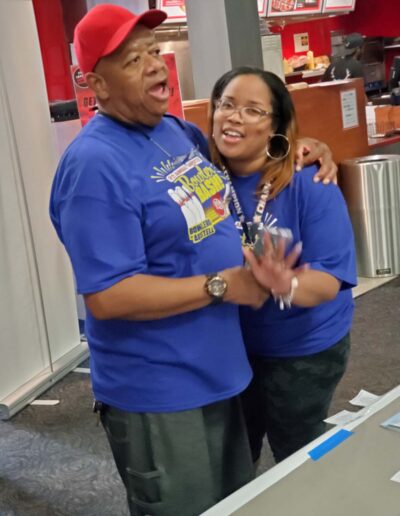 Couple having fun at bowler bash