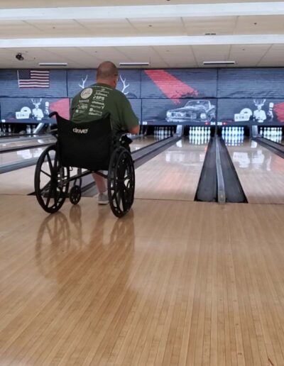 Man in wheelchair bowling