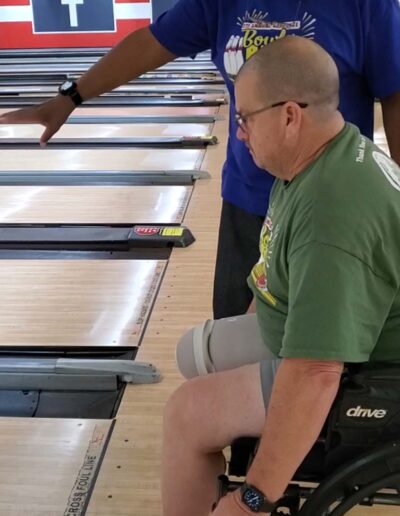 Man in wheelchair bowling