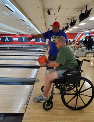 Man in wheelchair bowling