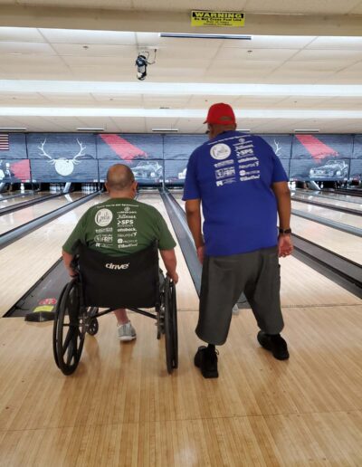 Man in wheelchair bowling